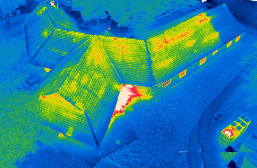 Thermal Building Survey | The cold roof in this image is displaying heat loss and should be investigated for thermal anomalies.