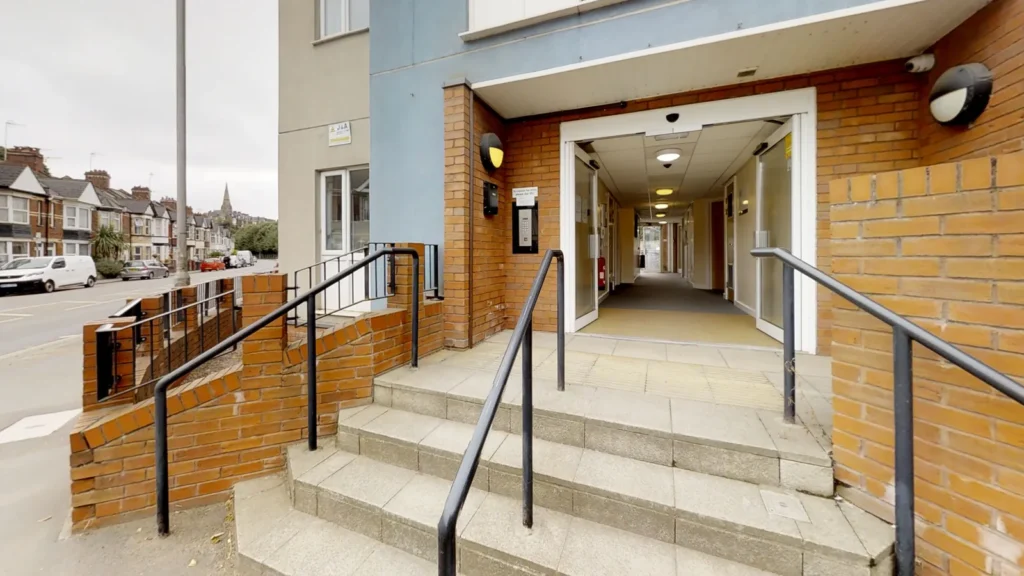 Building entrance with steps and handrails for an access survey