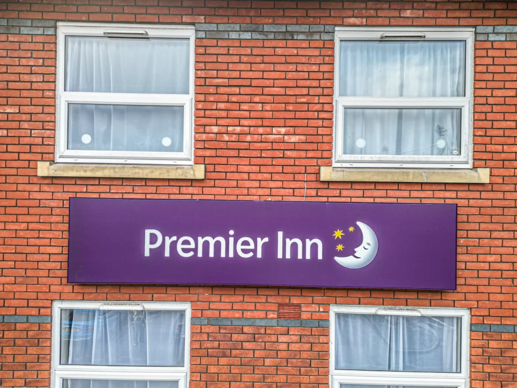 Drone image of a hotel wall sign on brickwork