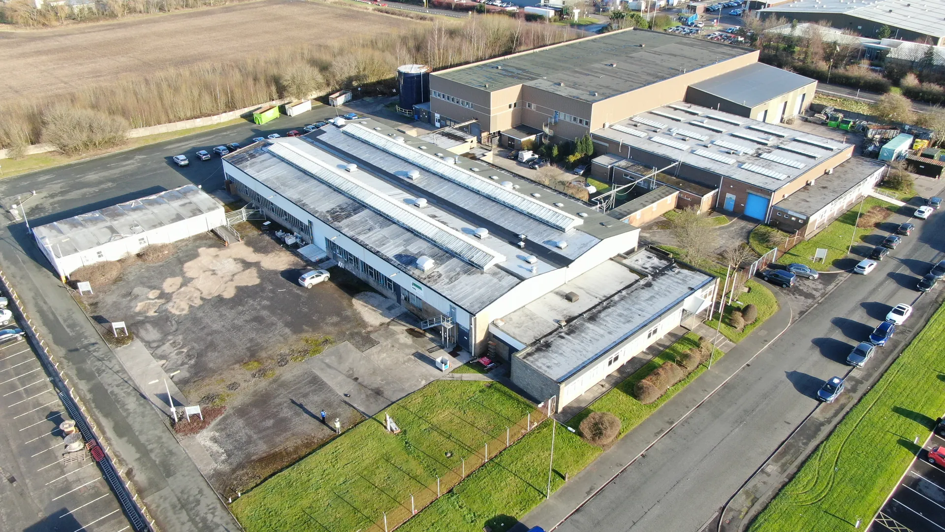 Aerial view of an industrial estate with warehouses and car parks