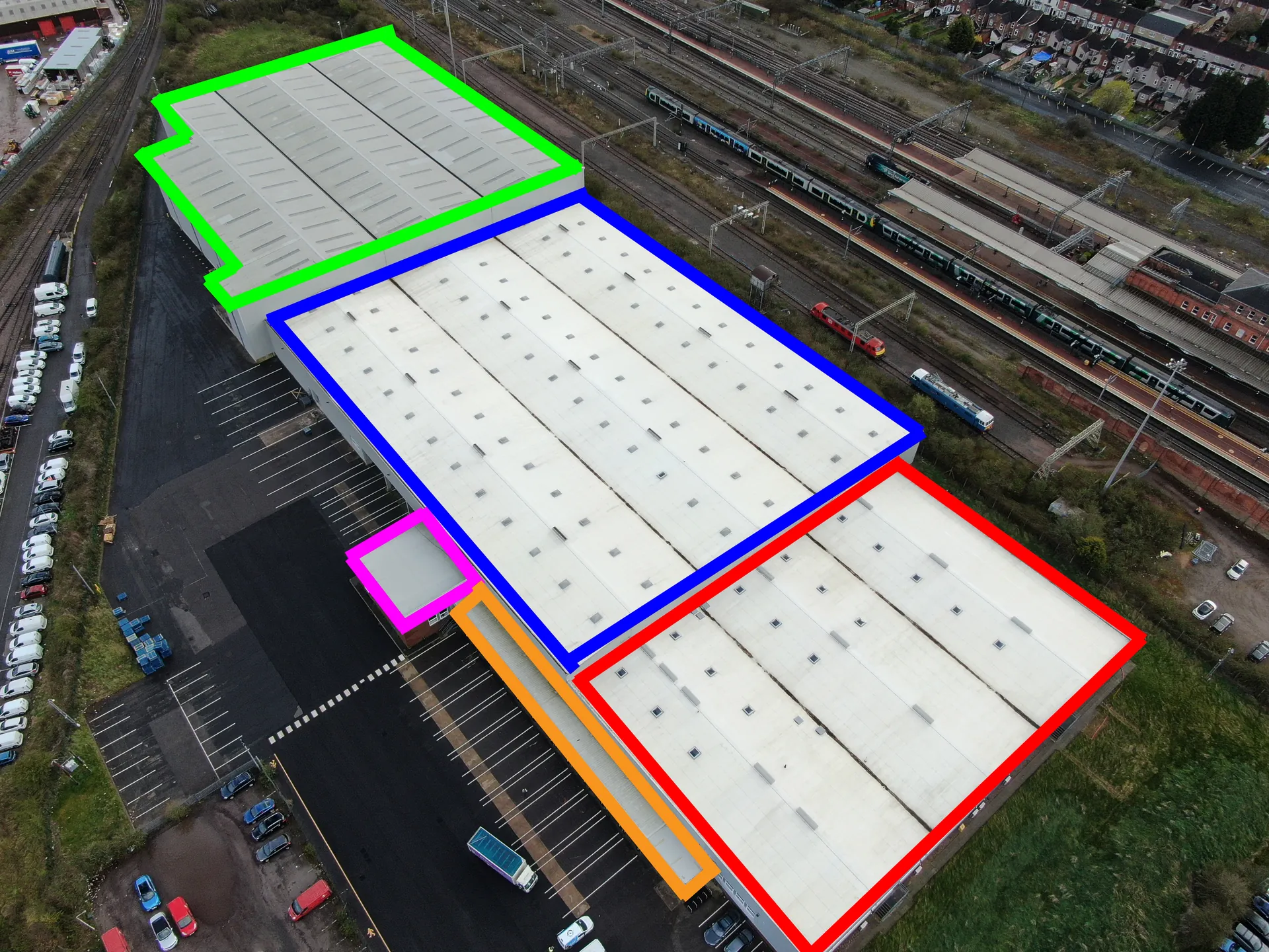 Oblique drone view of industrial unit roofs outlined into survey sections