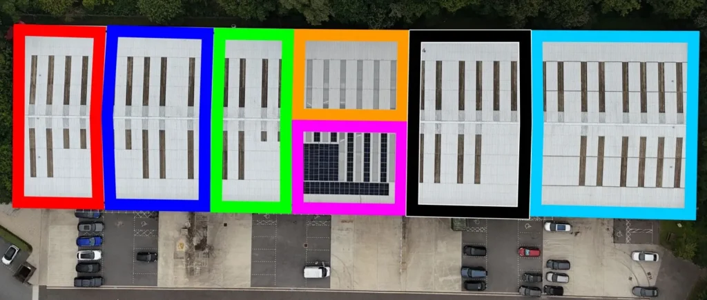 Row of industrial unit roofs with solar panels split into survey sections