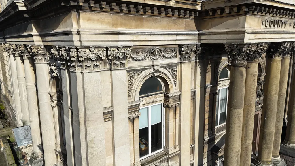 Drone inspection in North Wales: carved stone facade with columns