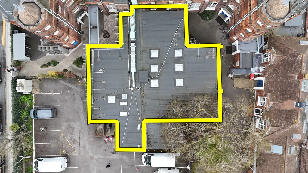 Drone school inspection in Swansea: flat school roof outlined for survey