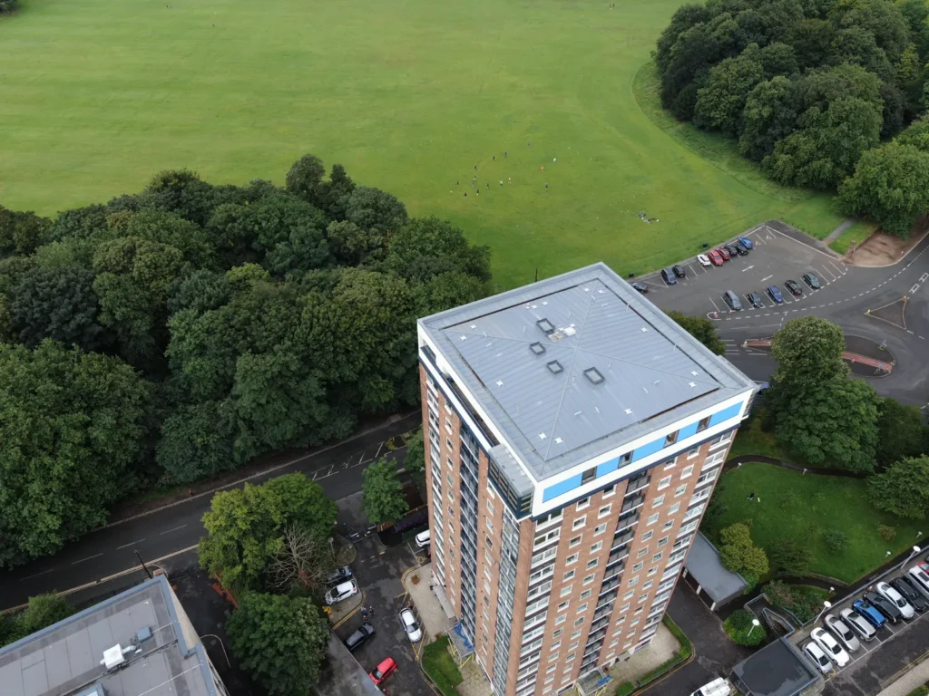 Aerial view of a residential tower block and its flat roof