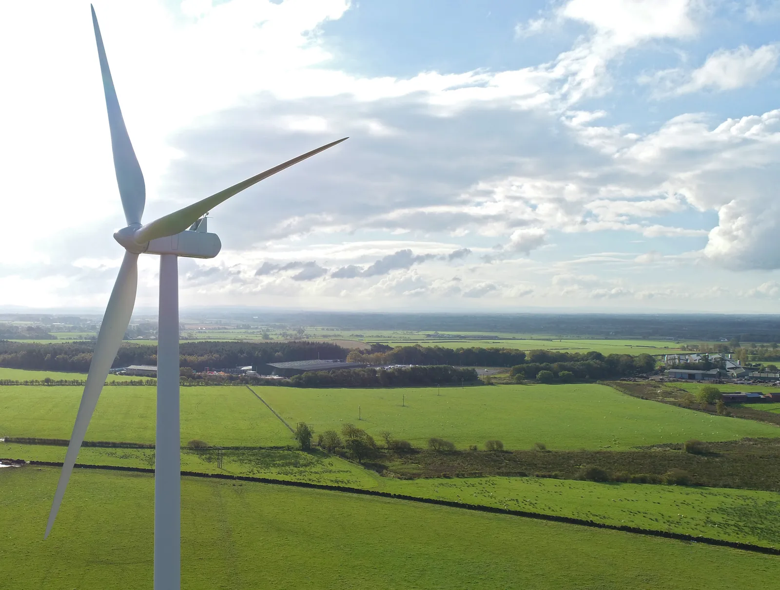 Wind turbine blade and tower photographed by drone